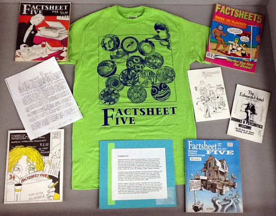 Dispaly case with Factsheet Five T-shirt and assorted issues of the zine.