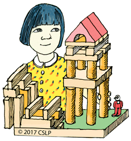 Image of a young girl behind a set of building blocks