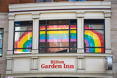 Part of the Hilton Garden Inn, with a rainbow that spans three windows.