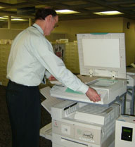 Man using a photocopier