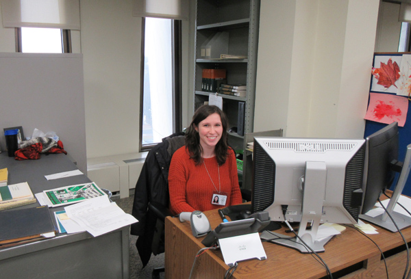 A staff member at her desk in the Cataloging Unit