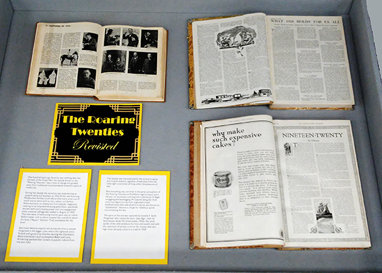 Display case, title card and editorials
