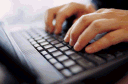 Image of hands on a computer keyboard