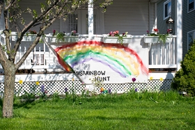 porch with homemade 518 Rainbow Hunt banner hanging on the railing