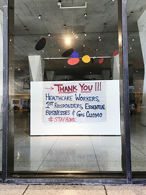 Painted wall inside museum lobby thanking essential workers, small businesses, and Governer Cuomo